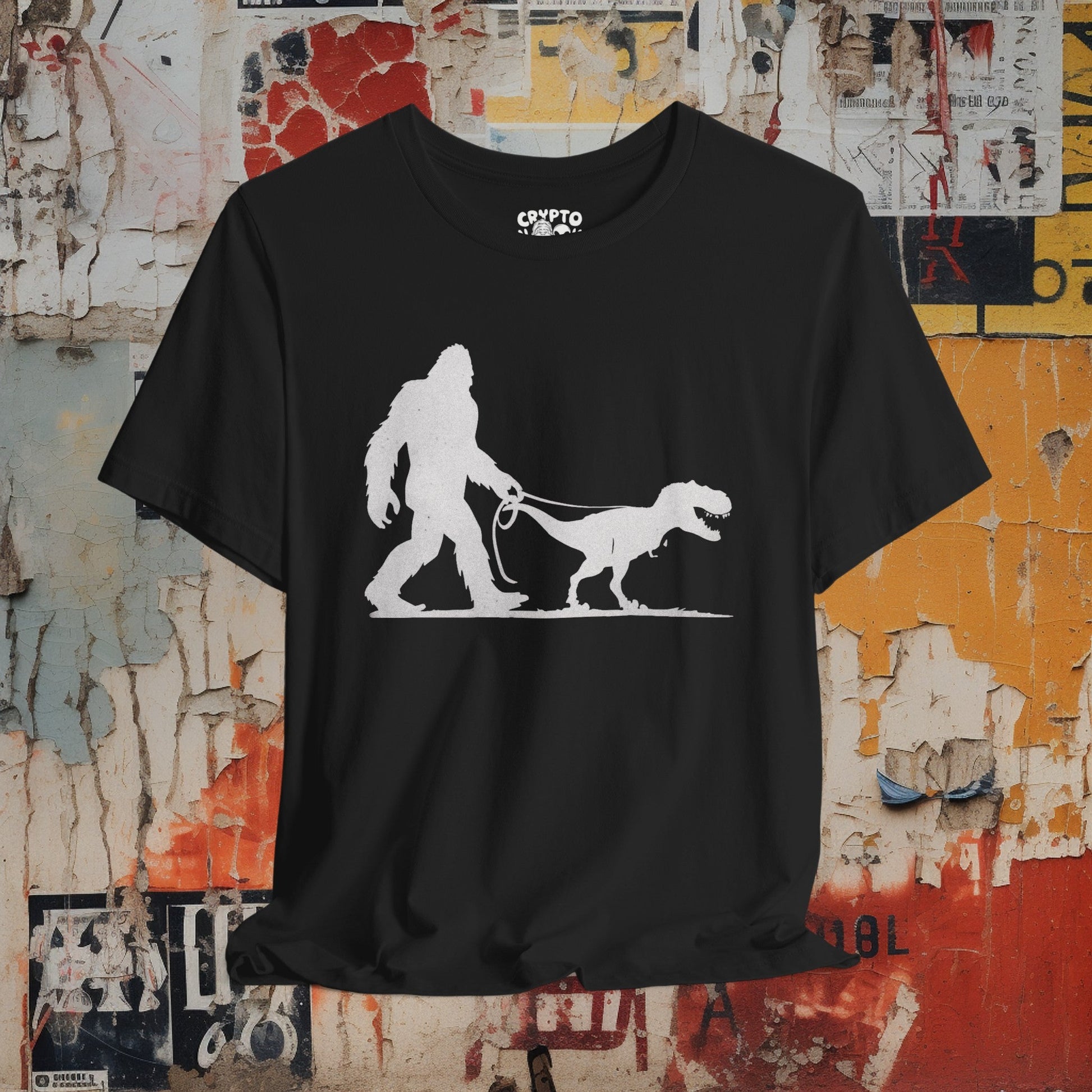 T-Shirt - Bigfoot Walking Baby T-Rex Dinosaur Shirt | Bella + Canvas Unisex T-shirt from Crypto Zoo Tees