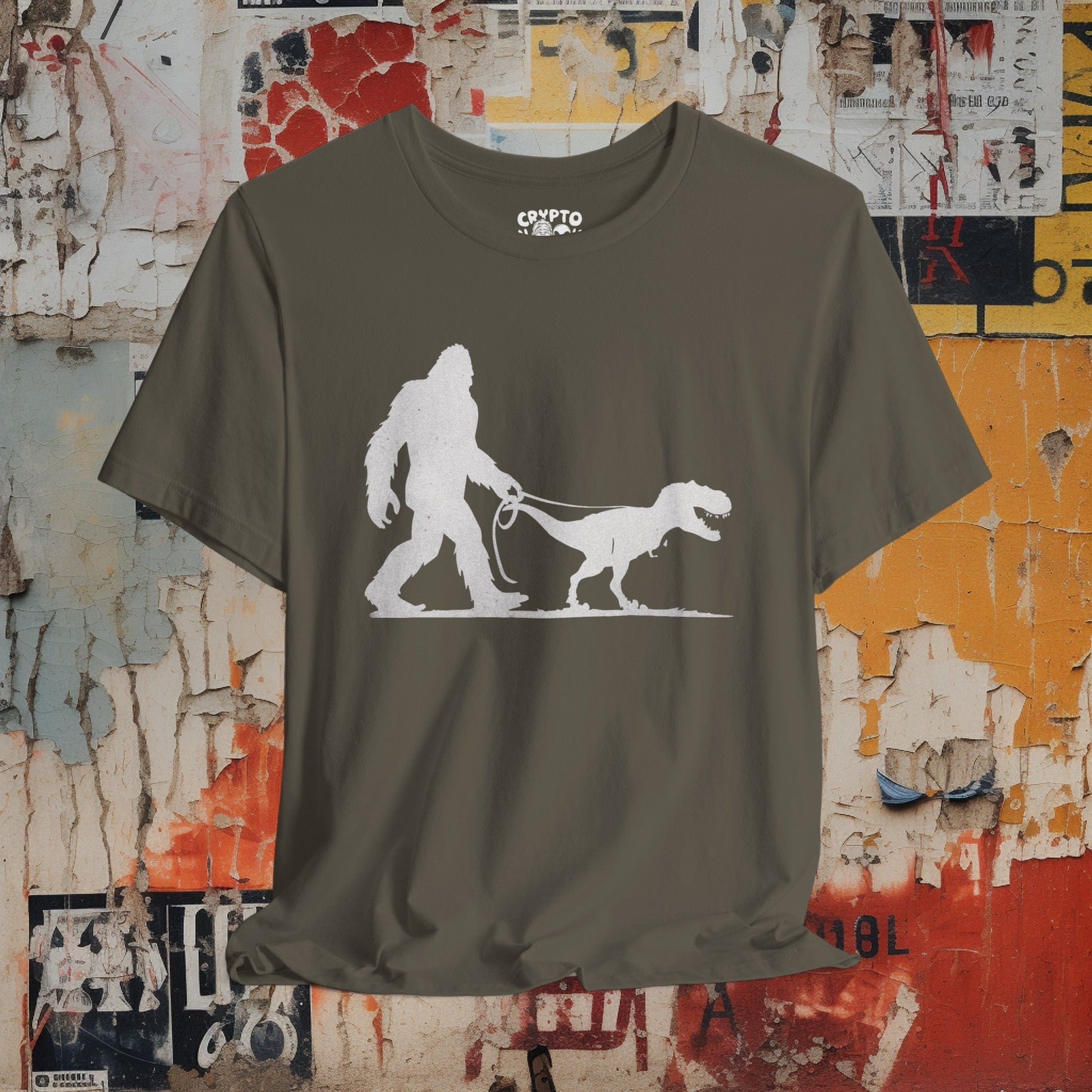 T-Shirt - Bigfoot Walking Baby T-Rex Dinosaur Shirt | Bella + Canvas Unisex T-shirt from Crypto Zoo Tees