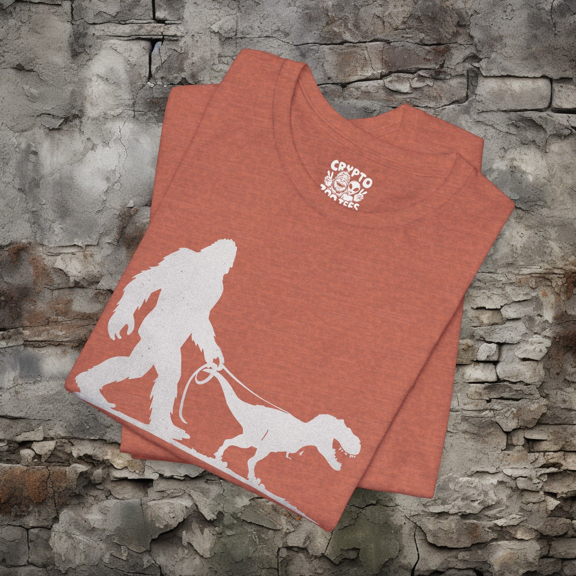 T-Shirt - Bigfoot Walking Baby T-Rex Dinosaur Shirt | Bella + Canvas Unisex T-shirt from Crypto Zoo Tees