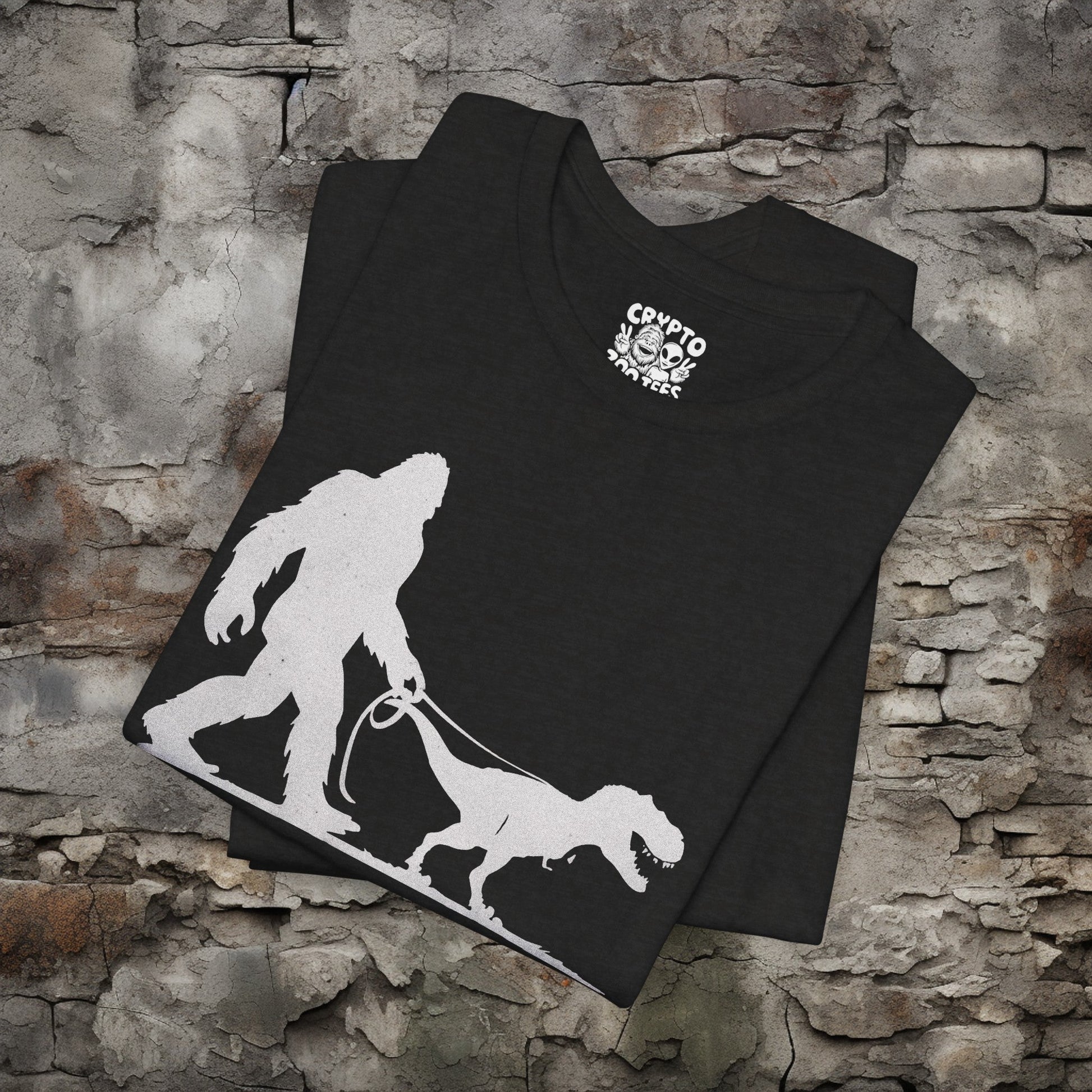 T-Shirt - Bigfoot Walking Baby T-Rex Dinosaur Shirt | Bella + Canvas Unisex T-shirt from Crypto Zoo Tees