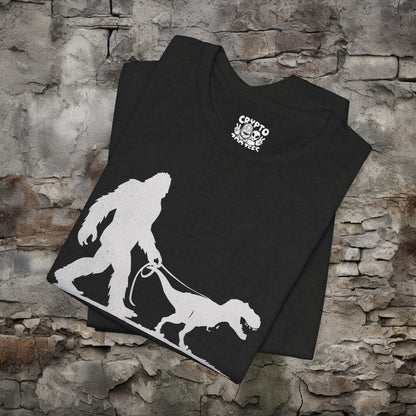 T-Shirt - Bigfoot Walking Baby T-Rex Dinosaur Shirt | Bella + Canvas Unisex T-shirt from Crypto Zoo Tees