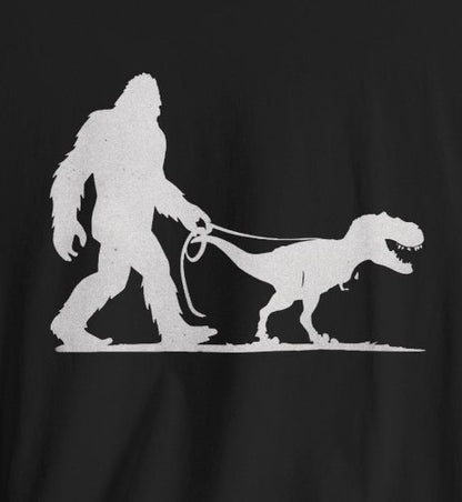 T-Shirt - Bigfoot Walking Baby T-Rex Dinosaur Shirt | Bella + Canvas Unisex T-shirt from Crypto Zoo Tees