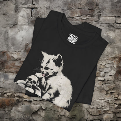 T-Shirt - Cat Licking Paw on Pile of Skulls Dark Humor Shirt | Bella + Canvas Unisex T-shirt from Crypto Zoo Tees