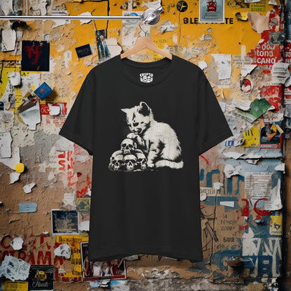 T-Shirt - Cat Licking Paw on Pile of Skulls Dark Humor Shirt | Bella + Canvas Unisex T-shirt from Crypto Zoo Tees